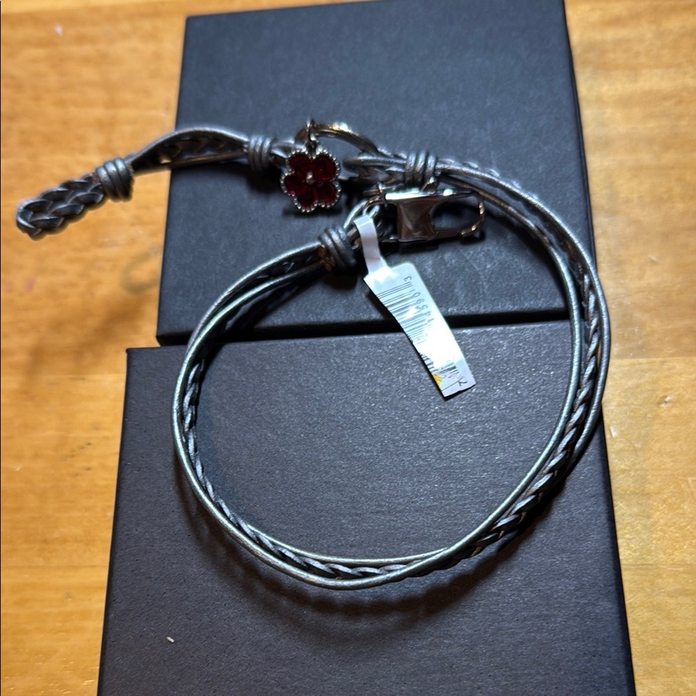 Stylish Silver Braided Bracelet with Red Flower Charm